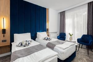 Postel nebo postele na pokoji v ubytování Hotel Soimul