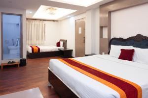 Rúm í herbergi á Hotel Kathmandu square
