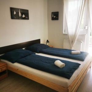 Postel nebo postele na pokoji v ubytování 4Season Apartman