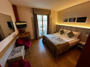 TV a/nebo společenská místnost v ubytování Hotel Cortese