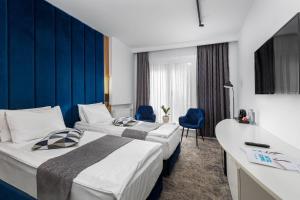 Postel nebo postele na pokoji v ubytování Hotel Soimul