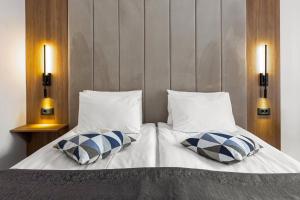Postel nebo postele na pokoji v ubytování Hotel Soimul
