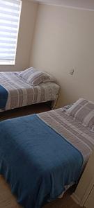 Ένα ή περισσότερα κρεβάτια σε δωμάτιο στο Departamento Puerto Varas, a pocos pasos del lago