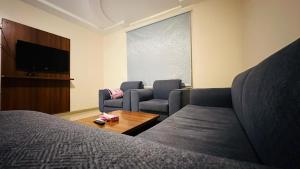 Μια τηλεόραση ή/και κέντρο ψυχαγωγίας στο Basma Residences-شقق البسمة