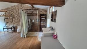a bathroom with a sink and a shower at Le Cottage de Jousseaume in Mortagne-sur-Sèvre +35 photos