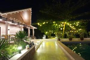 a patio lit up at night with lights at Villa Minerva Eco-Farm Resort near Vigan in Fuerte