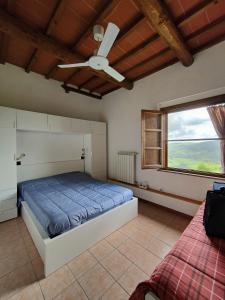 Postel nebo postele na pokoji v ubytování La Pergoletta