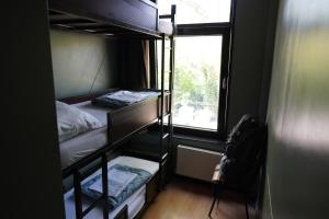 Onefam Amstel客房内的一张或多张床位