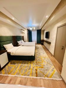 Postel nebo postele na pokoji v ubytování HOTEL AYNI