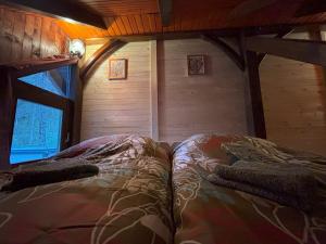 Postelja oz. postelje v sobi nastanitve Camping & Glamping Grintovec