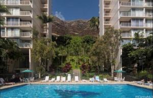 a swimming pool in front of a apartment building at Makaha Valley Oasis 1-Bedroom apts in Waianae