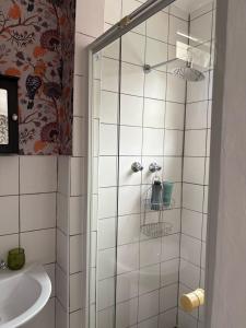 a bathroom with a shower and a sink at Studio at 142 in Durban