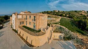 an aerial view of a large brick building at Villa Sant'Angelo in Alba Adriatica