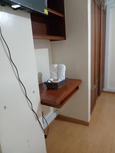 a room with a wooden table in a room at Hotel Pinzon Plaza in Tunja