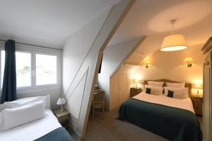 Postel nebo postele na pokoji v ubytování Cit'Hotel La Villa Julia
