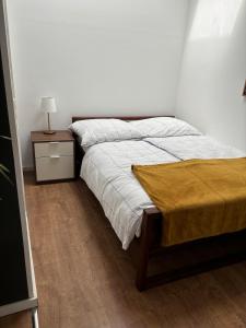 a bedroom with a bed and a table with a lamp at Moderne Wohnung Kerpen in Kerpen +27 photos