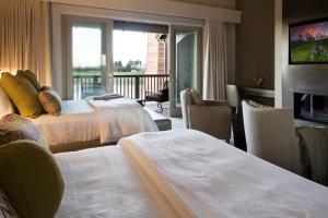 Postel nebo postele na pokoji v ubytování SENZA Hotel