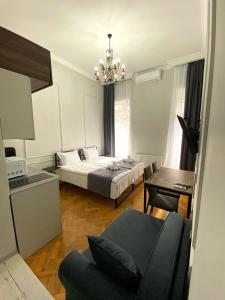 Postel nebo postele na pokoji v ubytování Aparthotel Mtatsminda