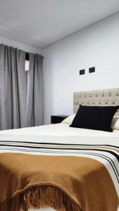 Postel nebo postele na pokoji v ubytování Caleta Design Departamento frente al mar