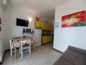 A kitchen or kitchenette at Paradise Flat - View, Garden & Parking (200Mt Sea)