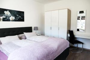 Ένα ή περισσότερα κρεβάτια σε δωμάτιο στο Appartements Setzbergblick