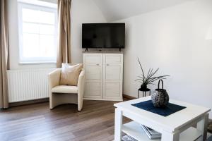Μια τηλεόραση ή/και κέντρο ψυχαγωγίας στο Appartements Setzbergblick