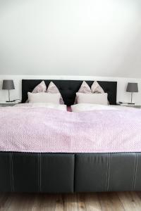 Ένα ή περισσότερα κρεβάτια σε δωμάτιο στο Appartements Setzbergblick