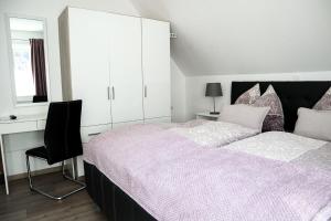 Ένα ή περισσότερα κρεβάτια σε δωμάτιο στο Appartements Setzbergblick