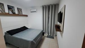 Katil atau katil-katil dalam bilik di Apartamento climatizado- Excelente localização