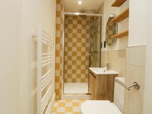 a bathroom with a shower and a toilet and a sink at Garden flat on The Hoe - Tamar in Plymouth +22 photos