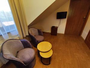 Un televizor și/sau centru de divertisment la Hotel Winnica Maria Anna
