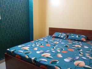 Postel nebo postele na pokoji v ubytování Rukmini Guest House