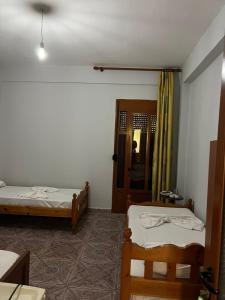 Postel nebo postele na pokoji v ubytování Begaj Rooms