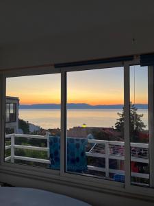 a view of the ocean from a bedroom window at Apartment Jenul in Labin