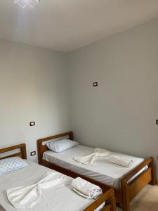 Postel nebo postele na pokoji v ubytování Begaj Rooms