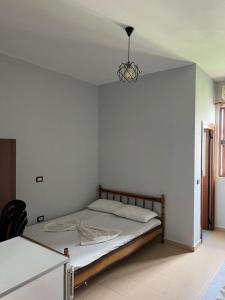 Postel nebo postele na pokoji v ubytování Begaj Rooms