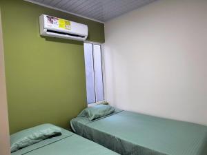 Giường trong phòng chung tại Cactus Beach Stay APARTAMENTO