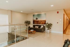 a living room with a couch and a staircase at Hotel do Sertão in Custódia +100 photos