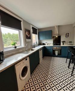a kitchen with a sink and a dishwasher in it at Sapphire Quarters, 3BR, En Suite, Private Parking in Hindlip