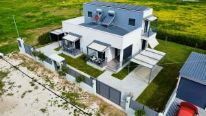 an aerial view of a house with a solar roof at Neo-Residence in Neochórion +26 photos