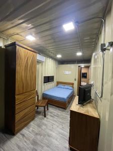 Postel nebo postele na pokoji v ubytování OHANA HOTEL & VILLA