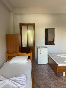 Postel nebo postele na pokoji v ubytování Begaj Rooms