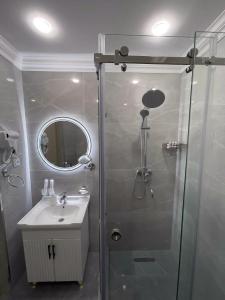 a bathroom with a shower and a sink at Emily Grand Palace in Samarkand