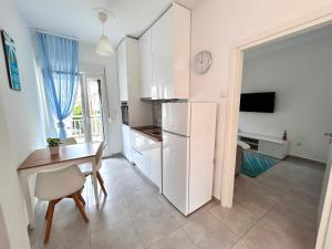 Kuchyňa alebo kuchynka v ubytovaní Sea Pleasure Apartment II