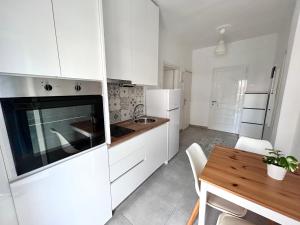 Kuchyňa alebo kuchynka v ubytovaní Sea Pleasure Apartment II