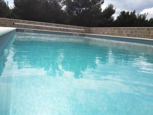 a large swimming pool with blue water at Camp Krka in Lozovac