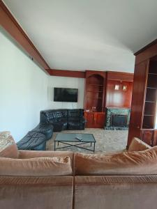 a living room with a couch and a table at Dúplex Tremp in Tremp