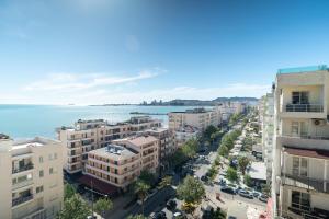 an aerial view of a city with buildings and the ocean at The blue pearl apartment 2 in Durrës