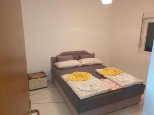 Postel nebo postele na pokoji v ubytování Apartmani Gusani