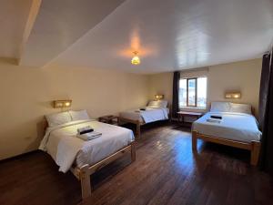 Postel nebo postele na pokoji v ubytování Eco Inn + 37 fotografií